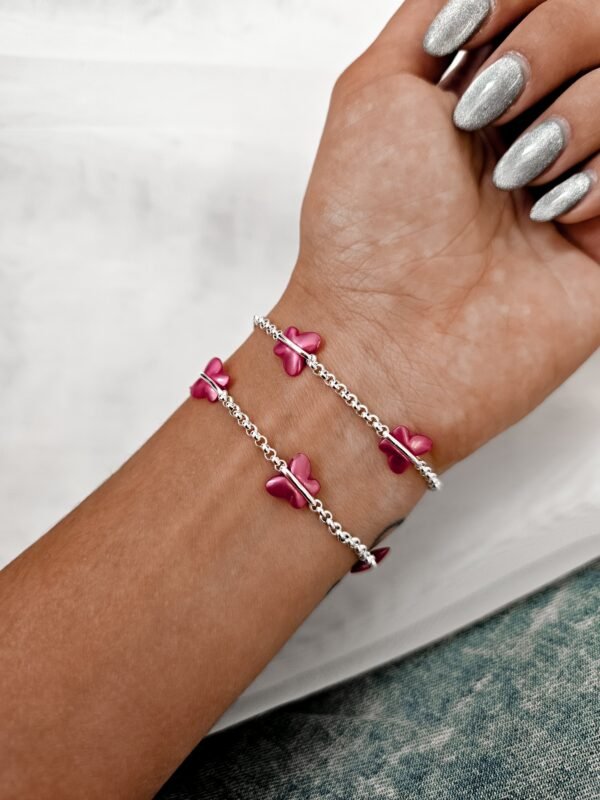 Pulsera mariposas fucsia acero blanco