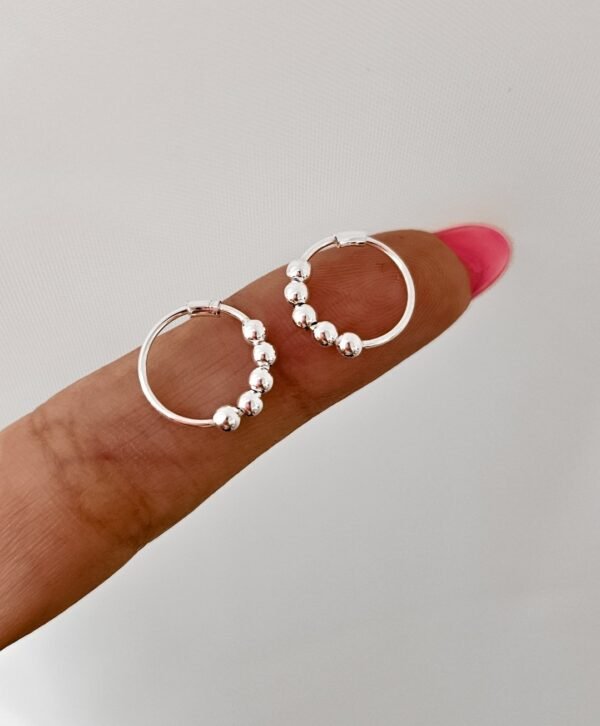 Piercing bolitas traba