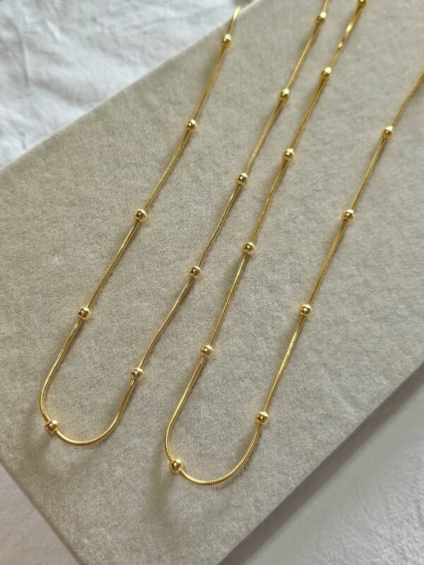 Collar balls acero dorado