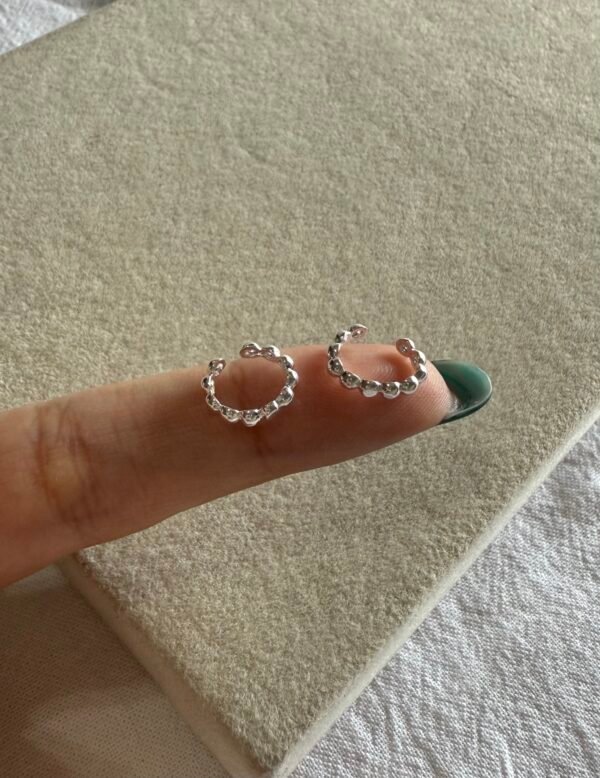 Cuff fini bolitas acero blanco