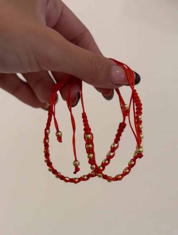 Pulsera bolitas roja acero dorado