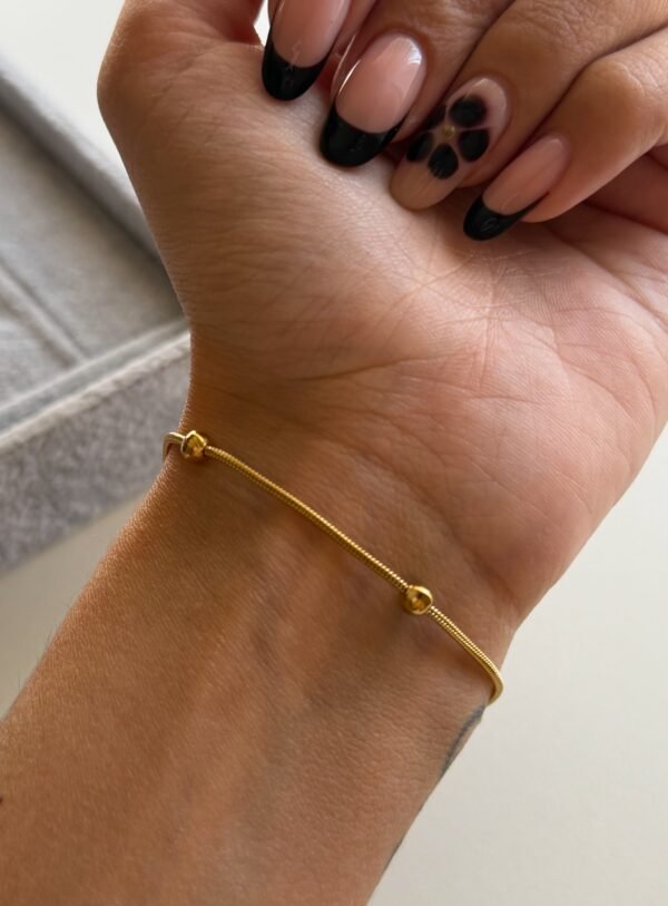 Pulsera balls acero dorado