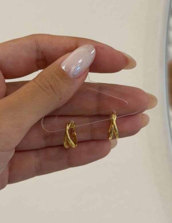 Argollitas cruzi acero dorado