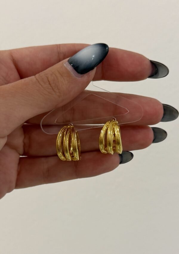 Argollas reversibles triple acero dorado